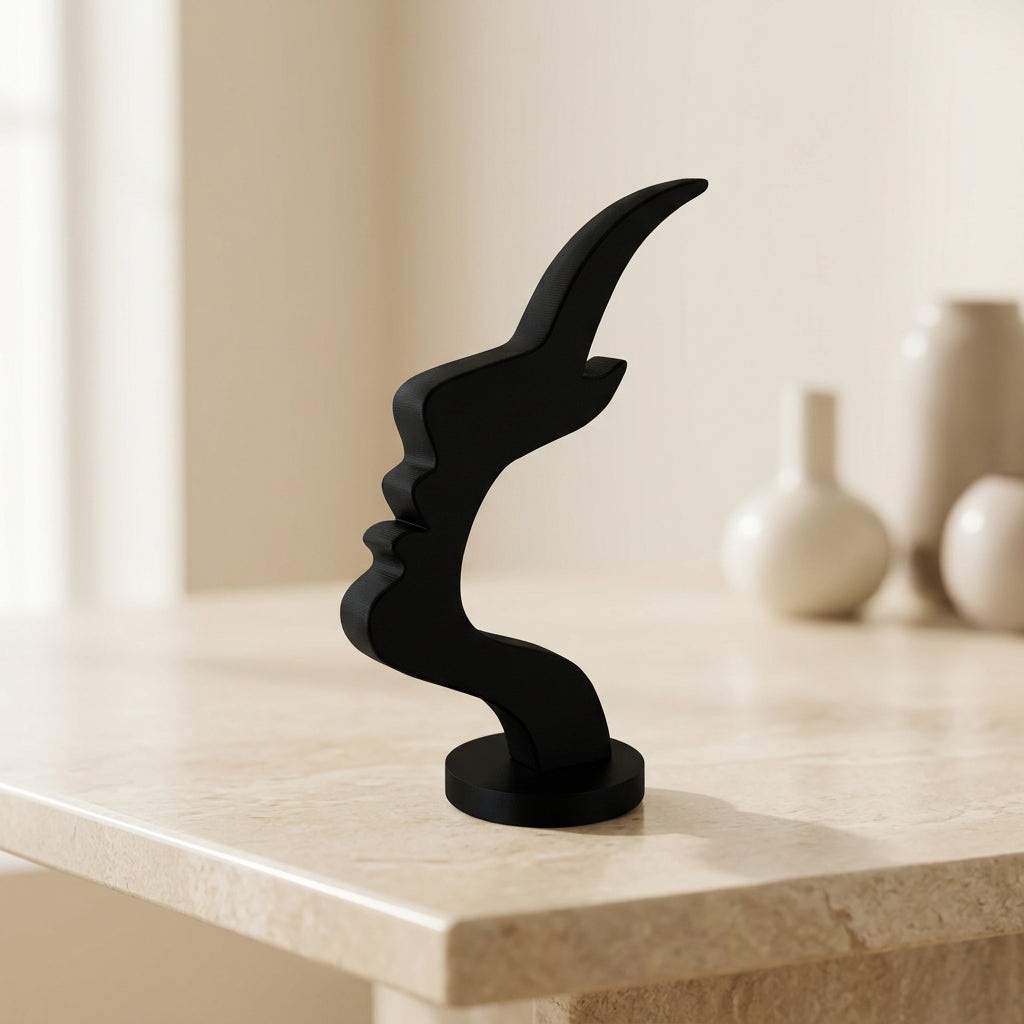 Black sculptural eyeglass holder featuring an abstract face silhouette and round base in a minimalist home setting. 